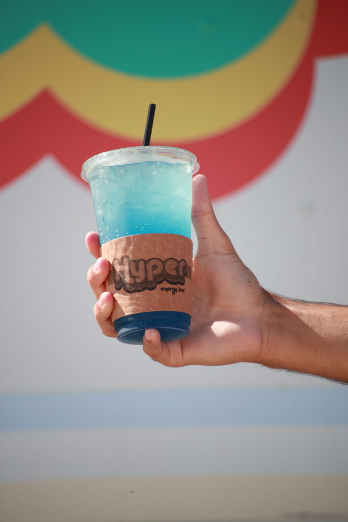 Car at a drive-through coffee shop window getting a drink